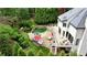 Aerial view showcasing an entertainer's backyard with a custom pool, patio, and lush landscaping at 520 Flying Scot Way, Alpharetta, GA 30005