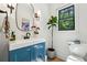 Bright bathroom with a stylish vanity, fresh plants, modern fixtures, and a window view at 520 Flying Scot Way, Alpharetta, GA 30005