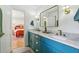 Stylish bathroom featuring dual sinks, modern fixtures, and access to the bedroom at 520 Flying Scot Way, Alpharetta, GA 30005