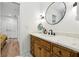 Bathroom featuring a wooden vanity with a marble countertop and modern fixtures at 520 Flying Scot Way, Alpharetta, GA 30005