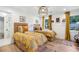 Guest bedroom featuring twin beds with bright coverings and natural light at 520 Flying Scot Way, Alpharetta, GA 30005