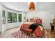Comfortable bedroom with modern decor and a seating area by a bay window at 520 Flying Scot Way, Alpharetta, GA 30005