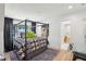 Stylish bedroom with canopy bed, hardwood floors, large windows and great natural light at 520 Flying Scot Way, Alpharetta, GA 30005