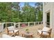 Relaxing deck with comfortable seating and view of backyard at 520 Flying Scot Way, Alpharetta, GA 30005