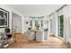 Elegant dining room with bay windows, hardwood flooring, and modern decor at 520 Flying Scot Way, Alpharetta, GA 30005