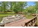 A pontoon boat is docked on a lake with mature trees in the background at 520 Flying Scot Way, Alpharetta, GA 30005