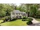 Charming two-story home with manicured lawn and mature landscaping at 520 Flying Scot Way, Alpharetta, GA 30005