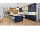 Large open kitchen with central island, custom cabinets, and stainless steel appliances at 520 Flying Scot Way, Alpharetta, GA 30005