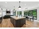 Bright kitchen featuring a large island, modern lighting, and a view to the outside deck at 520 Flying Scot Way, Alpharetta, GA 30005