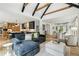 Open concept kitchen, dining, and living space with stylish furnishings, natural light, and modern appliances for entertainment at 520 Flying Scot Way, Alpharetta, GA 30005