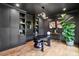 Office features built in cabinets, shelving, hardwood floors and unique light fixture at 520 Flying Scot Way, Alpharetta, GA 30005