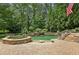 Backyard pool featuring a waterfall and hot tub at 520 Flying Scot Way, Alpharetta, GA 30005