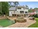 Lovely backyard pool and spa with stone accents and water feature, set in a beautifully landscaped yard at 520 Flying Scot Way, Alpharetta, GA 30005