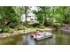 Beautiful waterfront home with a dock ready for boating and enjoying lake activities at 520 Flying Scot Way, Alpharetta, GA 30005