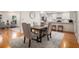 Dining area and open concept kitchen with hardwood floors and comfortable seating at 2360 Elon Way, Decatur, GA 30033
