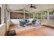 Inviting screened-in porch with terracotta floors, ceiling fan, and ample natural light at 2360 Elon Way, Decatur, GA 30033