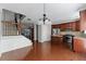 Eat-in kitchen with wooden cabinets and stainless steel appliances next to staircase at 2313 Millhaven St, Smyrna, GA 30080