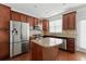 Kitchen with island, stainless steel appliances, and ample cabinet space at 2313 Millhaven St, Smyrna, GA 30080