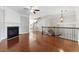 Open living area with hardwood floors, fireplace, and staircase to the upper level at 2313 Millhaven St, Smyrna, GA 30080
