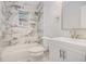 Marble-tiled bathroom with a shower and vanity at 554 Lawton Sw St, Atlanta, GA 30310