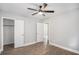 Bedroom with wood flooring, a ceiling fan, and a closet at 554 Lawton Sw St, Atlanta, GA 30310