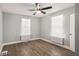 Bedroom featuring wood flooring, a ceiling fan, and lots of natural light at 554 Lawton Sw St, Atlanta, GA 30310