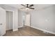 Bedroom with wood flooring, a ceiling fan, and a closet at 554 Lawton Sw St, Atlanta, GA 30310