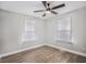 Bedroom featuring wood flooring, a ceiling fan, and lots of natural light at 554 Lawton Sw St, Atlanta, GA 30310