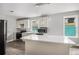 Bright kitchen features quartz countertops, stainless steel appliances, and hardwood floors at 554 Lawton Sw St, Atlanta, GA 30310