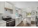 Bright, open kitchen with quartz countertops, stainless steel appliances and hardwood floors at 554 Lawton Sw St, Atlanta, GA 30310