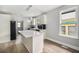Modern kitchen with quartz countertops, stainless steel appliances, and bright windows at 554 Lawton Sw St, Atlanta, GA 30310