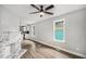 Open-concept living room featuring hardwood floors, fireplace, and natural light at 554 Lawton Sw St, Atlanta, GA 30310