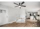 Open-concept living and kitchen area with hardwood floors and modern lighting at 554 Lawton Sw St, Atlanta, GA 30310