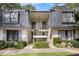 Charming condo exterior showcasing well-maintained landscaping and a welcoming entrance at 133 Maison Nw Pl, Atlanta, GA 30327