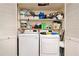 Laundry room featuring a full-sized washer and dryer, and plenty of extra storage at 133 Maison Nw Pl, Atlanta, GA 30327