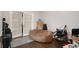 Versatile living area with French doors, a beanbag chair, and ample storage at 133 Maison Nw Pl, Atlanta, GA 30327