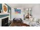 Open living room with fireplace, modern art, and seamless flow into other areas at 133 Maison Nw Pl, Atlanta, GA 30327
