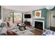 Inviting living room with a fireplace, window seat, and stylish decor at 133 Maison Nw Pl, Atlanta, GA 30327