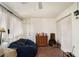 Living room featuring a ceiling fan, brick-tile floor and a dark-blue beanbag chair at 133 Maison Nw Pl, Atlanta, GA 30327