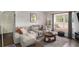 Cozy living room featuring a comfortable sofa, area rug, and a bright window seat at 133 Maison Nw Pl, Atlanta, GA 30327