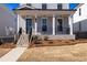 Beautiful home exterior showcasing well-maintained landscaping and inviting entrances with brick stairs at 173 Basil St, Cumming, GA 30040