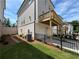 Exterior view of townhome with deck, garage, and manicured backyard at 173 Basil St, Cumming, GA 30040