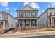 Charming two-story brick home with a welcoming front porch and well-manicured yard in a vibrant community at 173 Basil St, Cumming, GA 30040