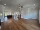 A living space with hardwood floors, recessed lighting and modern kitchen design at 173 Basil St, Cumming, GA 30040