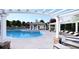 Community pool with pergola shade, lounge chairs and a bath house at 173 Basil St, Cumming, GA 30040