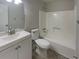 Bathroom featuring a single sink vanity, shower and tub combo, and tile flooring at 2067 Wellborn Close, Lithonia, GA 30058