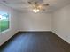 Empty bedroom with ceiling fan, new carpet, and lots of natural light at 2067 Wellborn Close, Lithonia, GA 30058