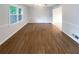 Dining room with hardwood flooring, natural light from a window, and classic wainscoting at 2067 Wellborn Close, Lithonia, GA 30058