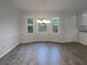 Bright dining room area with chandelier and lots of natural light at 2067 Wellborn Close, Lithonia, GA 30058