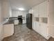 Spacious kitchen with stainless steel appliances and granite countertops and new cabinets at 2067 Wellborn Close, Lithonia, GA 30058